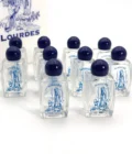 Lot de fioles en verre décorées de la Vierge de Lourdes, avec bouchons bleu nuit